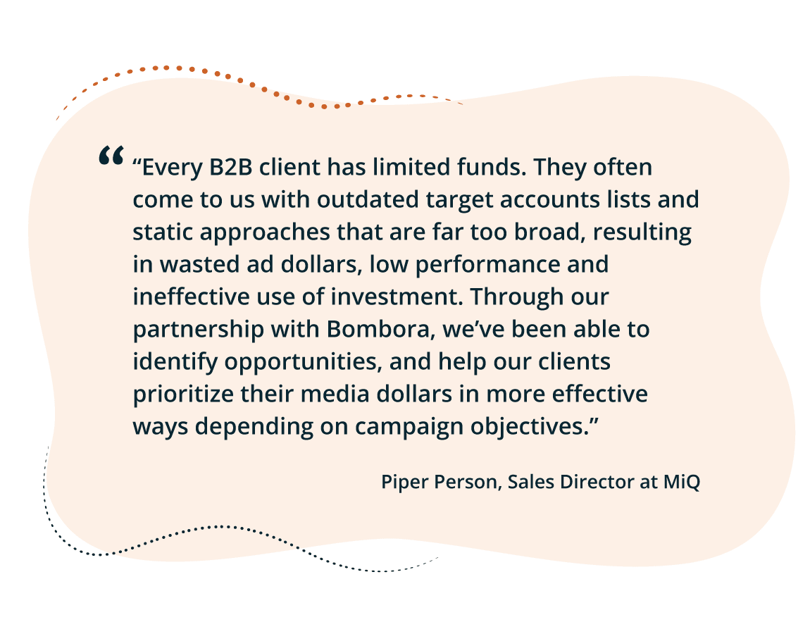 MiQ team analyzing B2B targeting data and campaign performance metrics on multiple screens